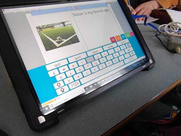 a tablet placed on a desk with clicker app on the screen