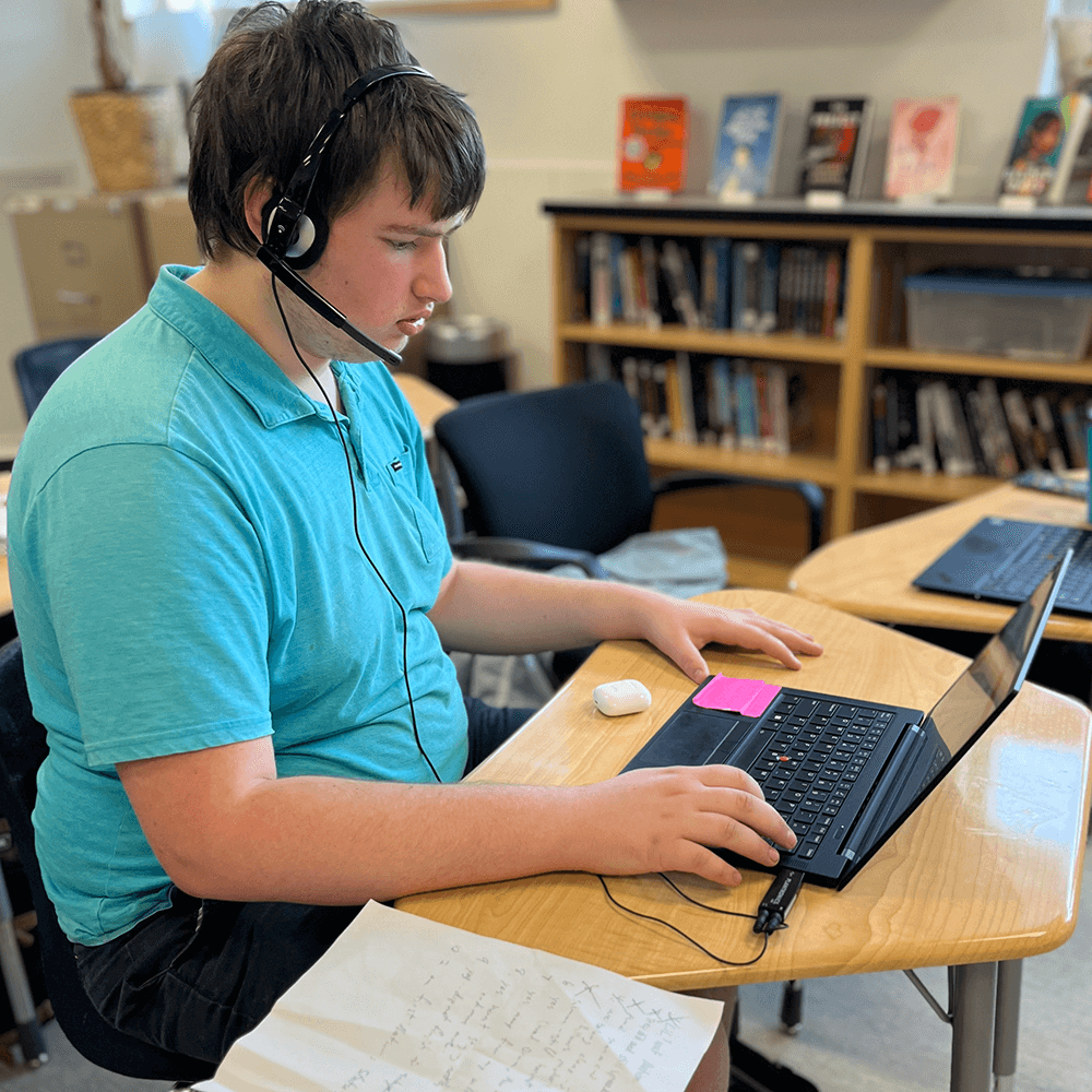 Remington uses Kurzweil 3000 and Dragon on his laptop.