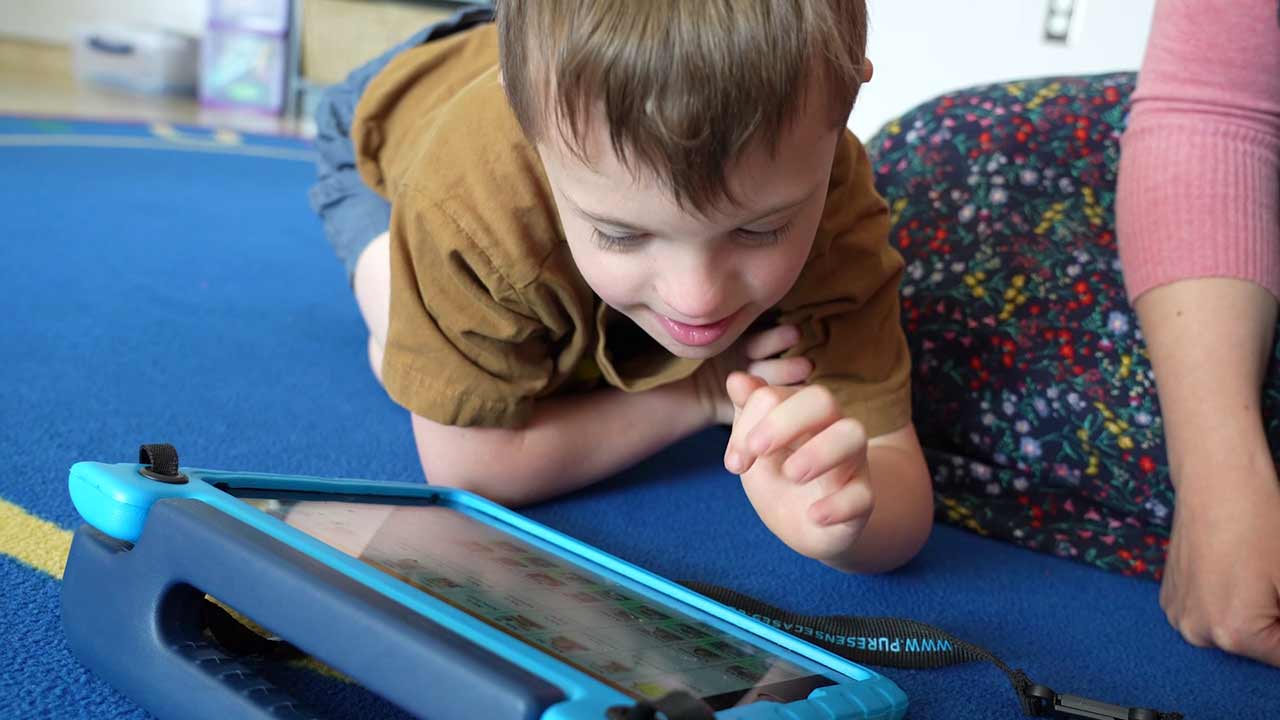 Student playing on an iPad in the classroom